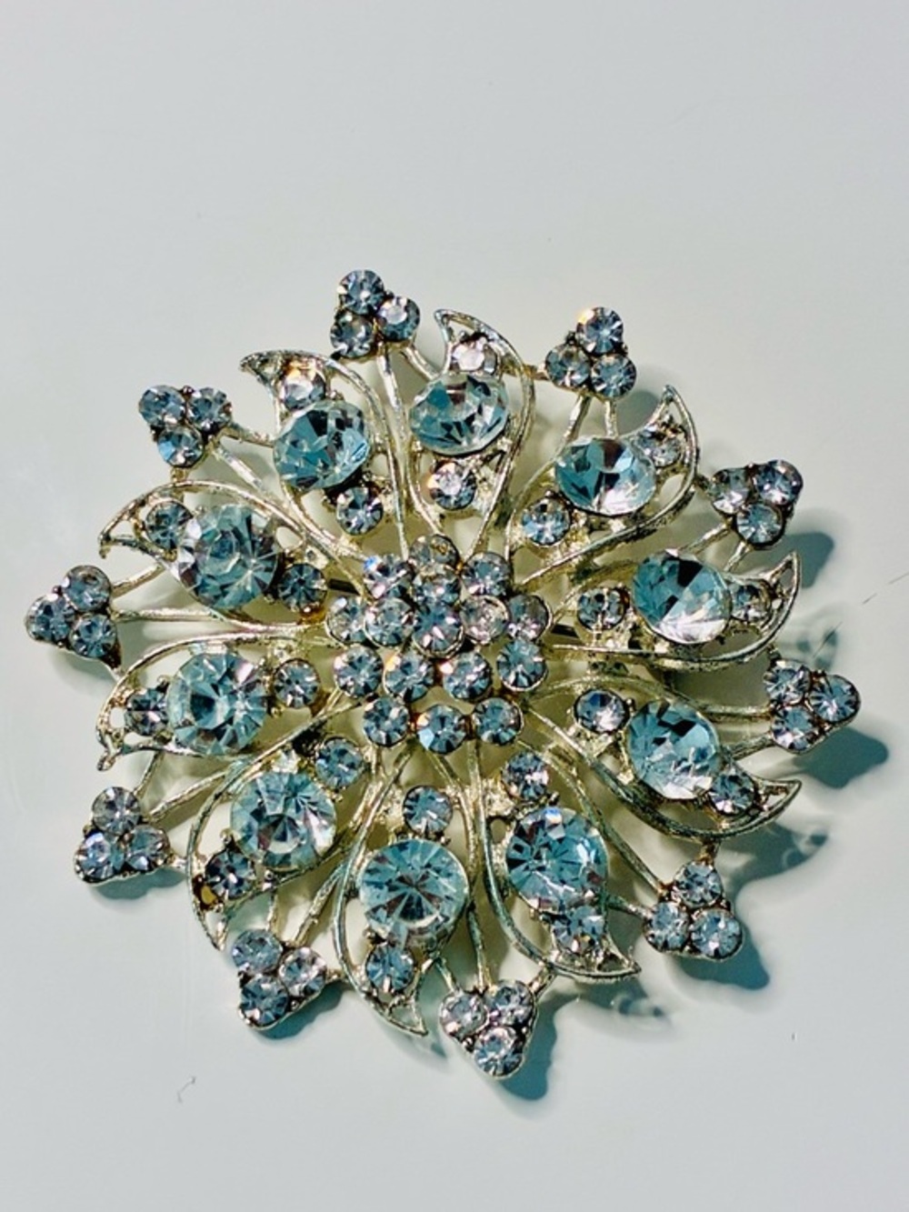 Crystal Floral Burst Brooch - Light Blue Rhinestone Accent